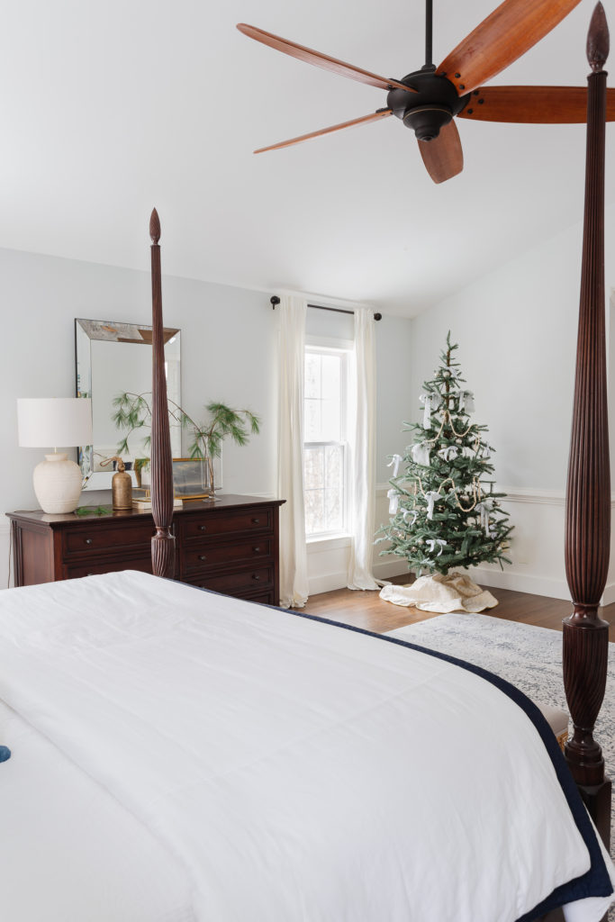 Bedroom with poster bed, dresser and Christmas tree